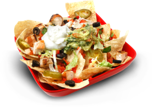 Nachos topped with sour cream and guacamole